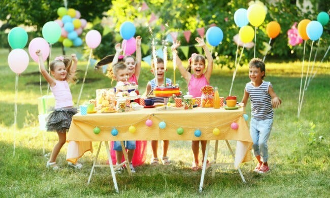 Children at an outdoor birthday party