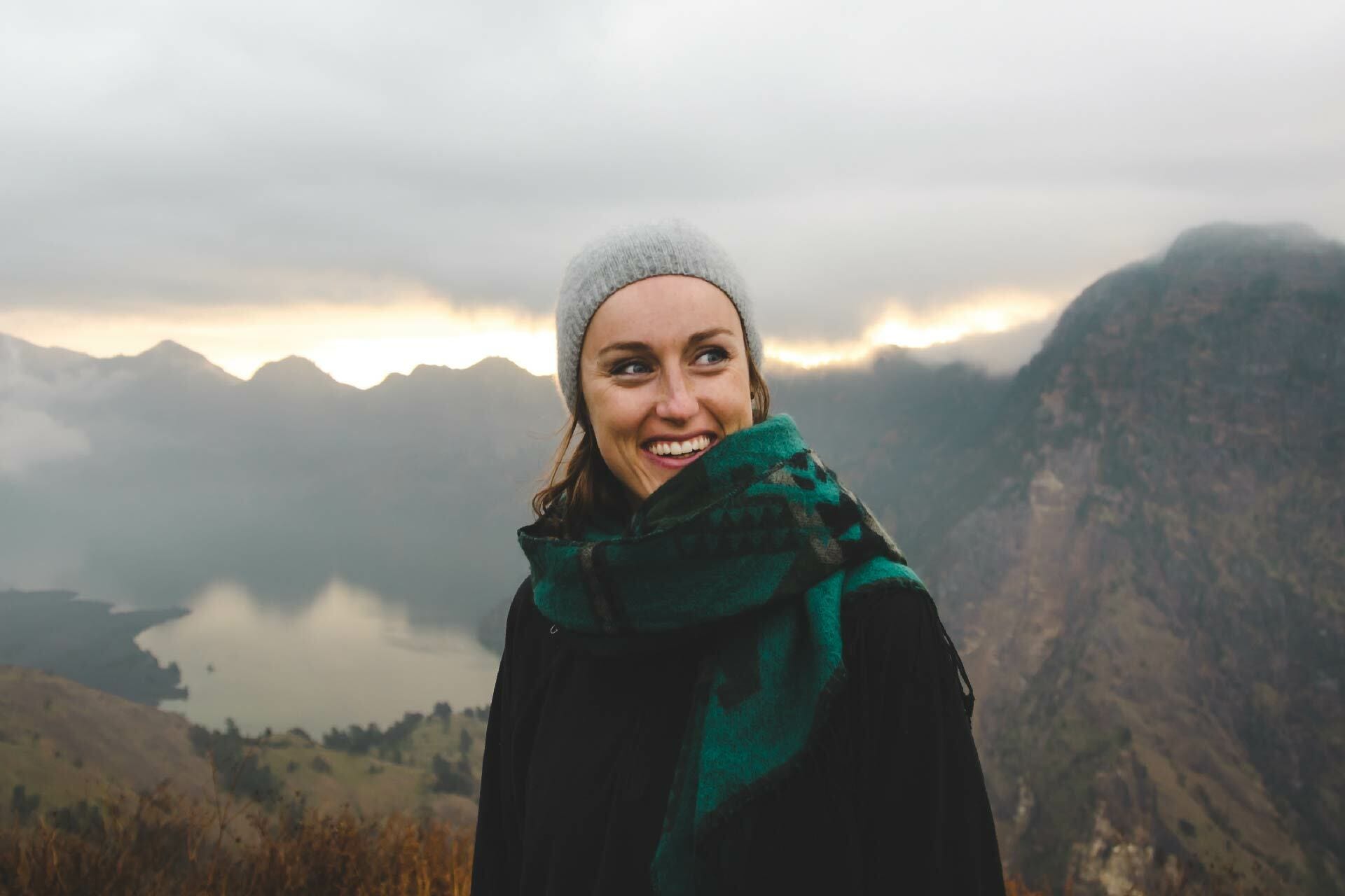 Woman smiling in mountains probiotics